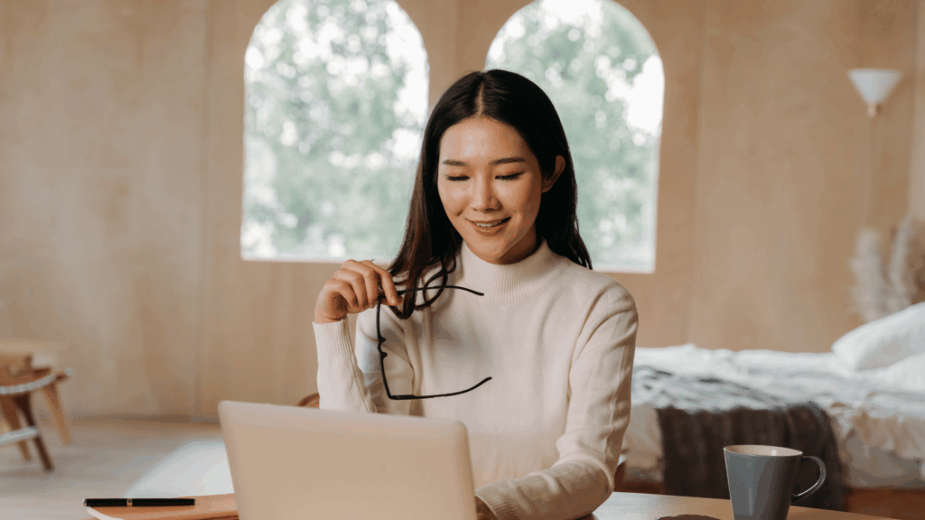 Female pathologist working remotely from home using a laptop with digital tools